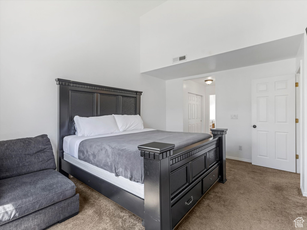 Bedroom with carpet floors and baseboards