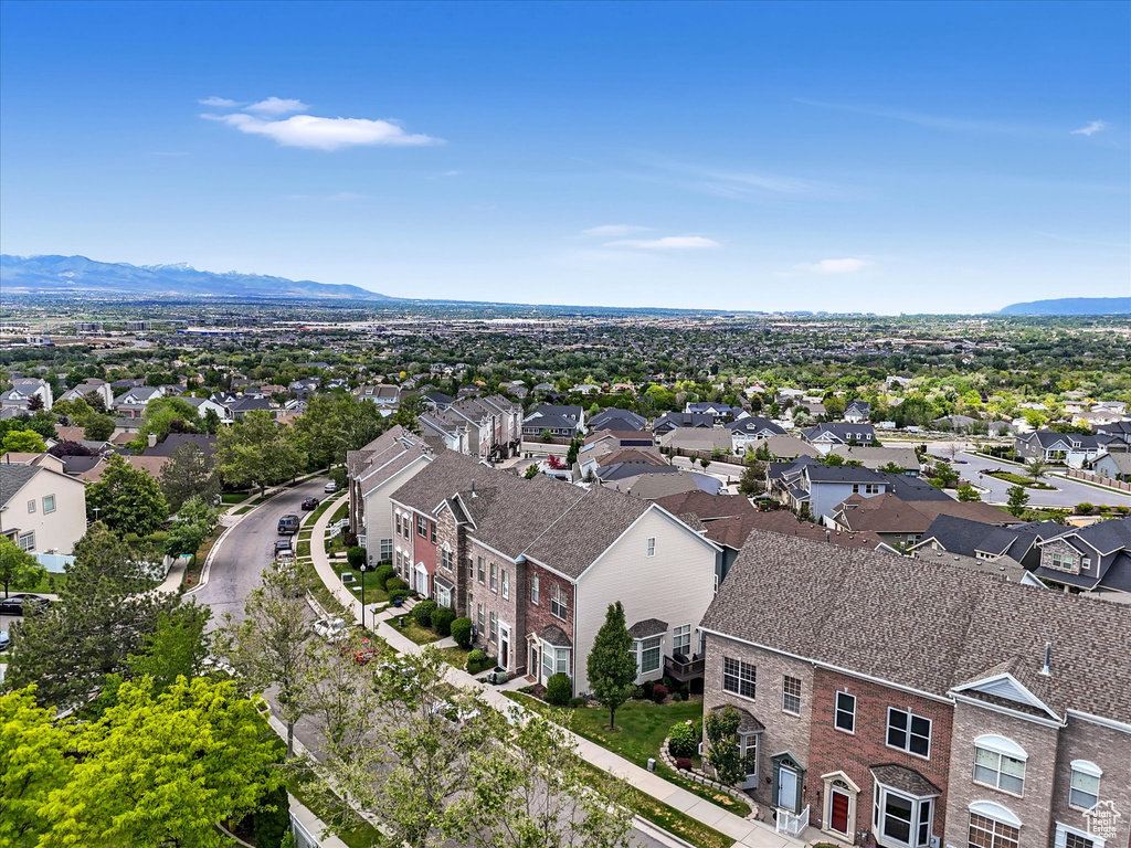 Aerial perspective of suburban area with a mountain backdrop