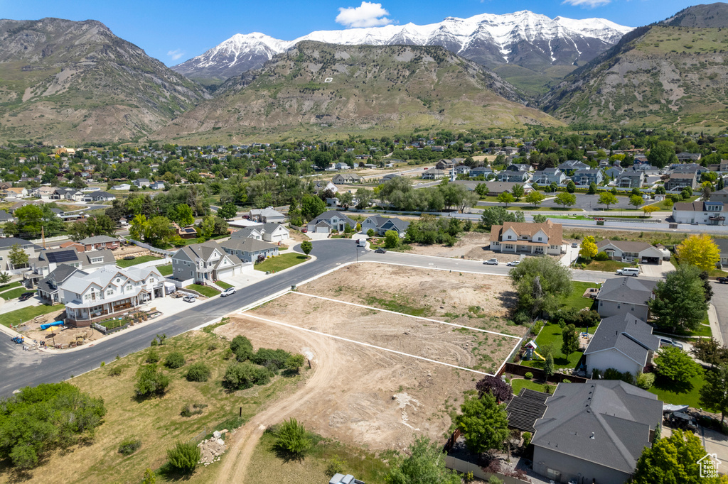 Aerial overview of property's location with nearby suburban area and mountains