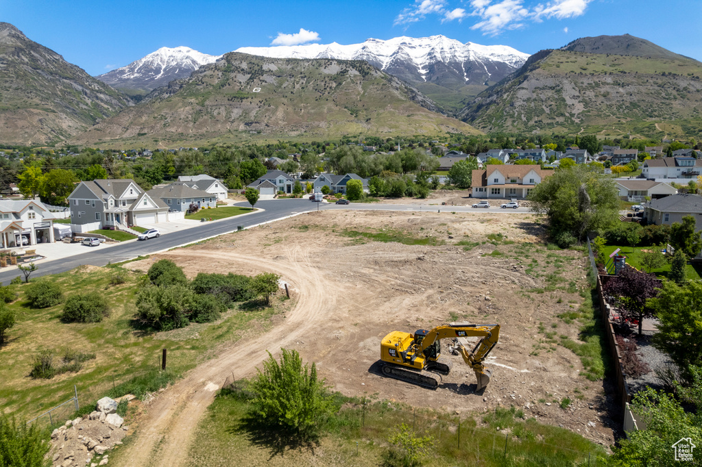View of mountain backdrop featuring nearby suburban area