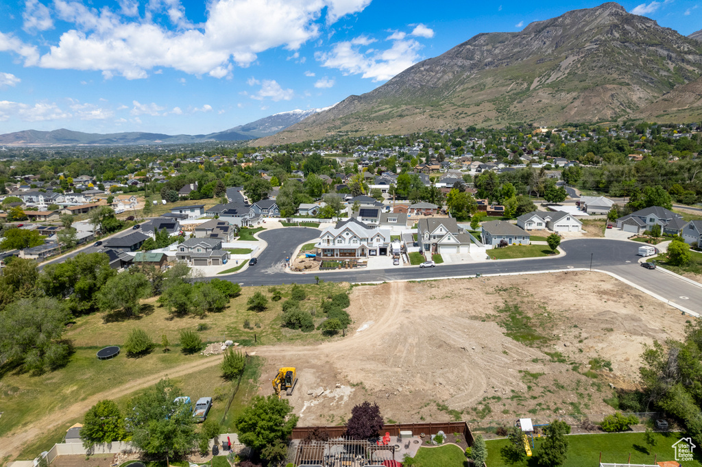 Aerial view of residential area featuring a mountain backdrop