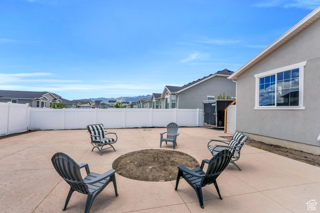 Fenced backyard with a patio and a residential view