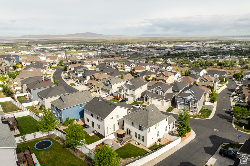 Aerial view of residential area with a mountainous background