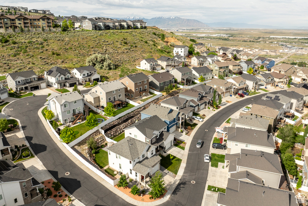 View of property location with mountains and nearby suburban area