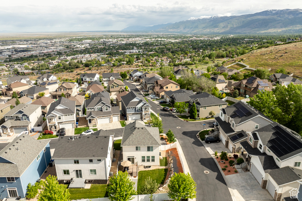 Aerial perspective of suburban area with a mountainous background