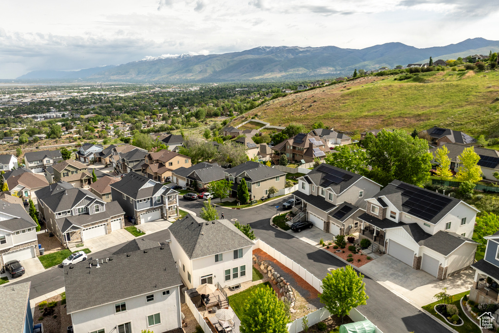 Aerial perspective of suburban area with a mountain backdrop