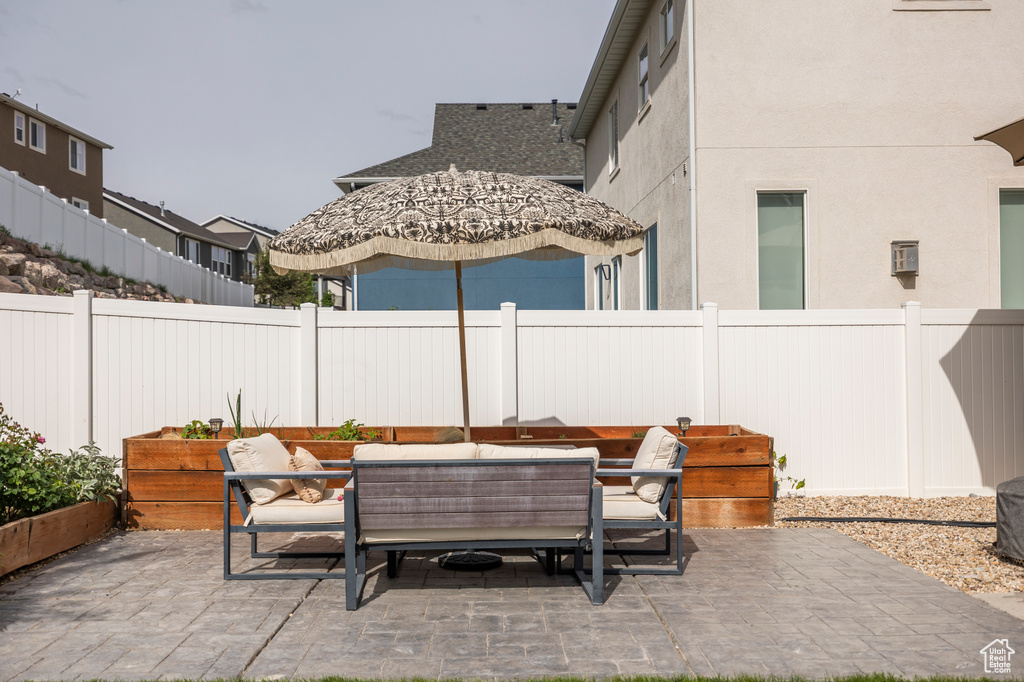 Fenced backyard with a patio