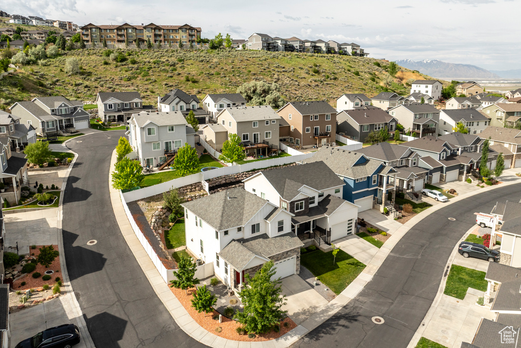 Aerial view of residential area featuring a mountain backdrop