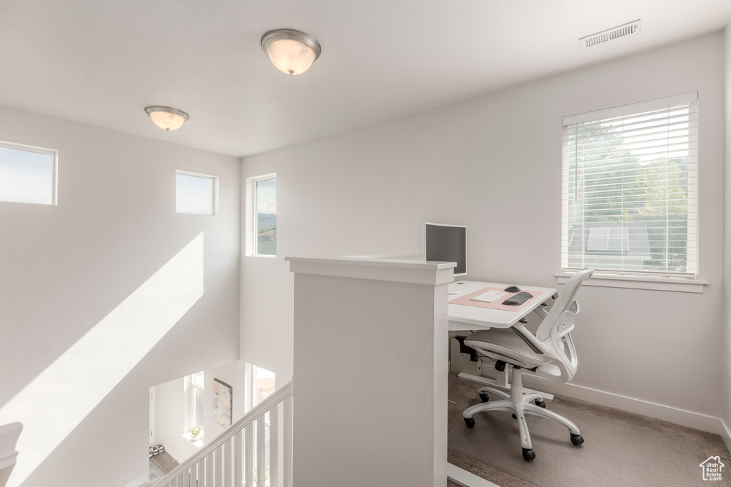 Office area featuring baseboards