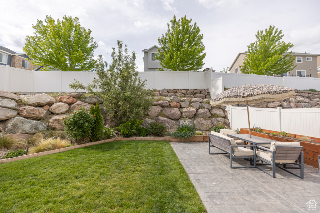 View of yard with a patio area and outdoor dining area