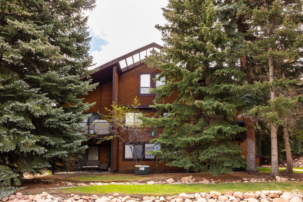 View of side of home with a balcony