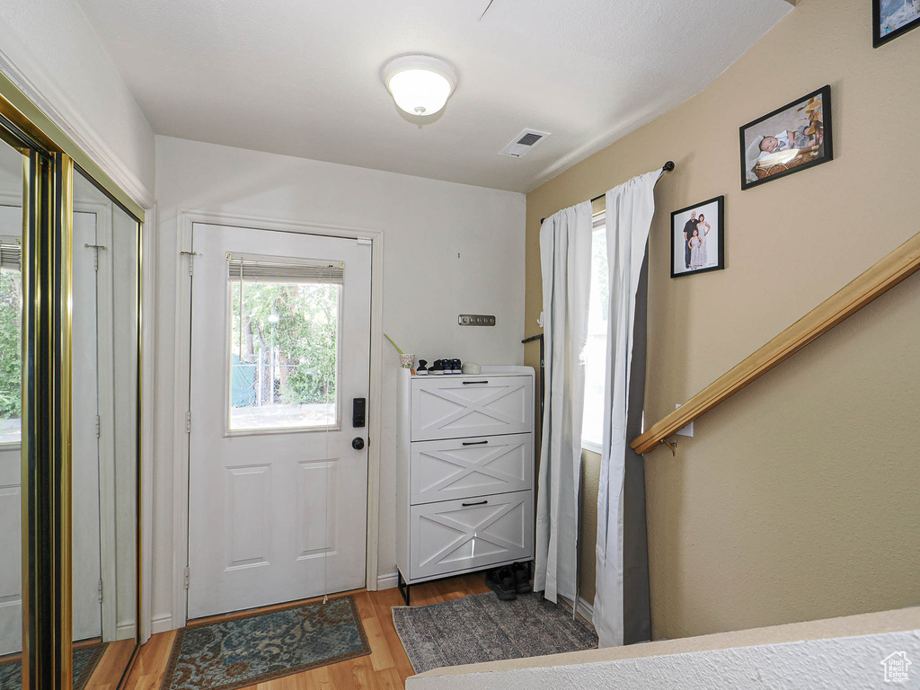 Foyer featuring wood finished floors