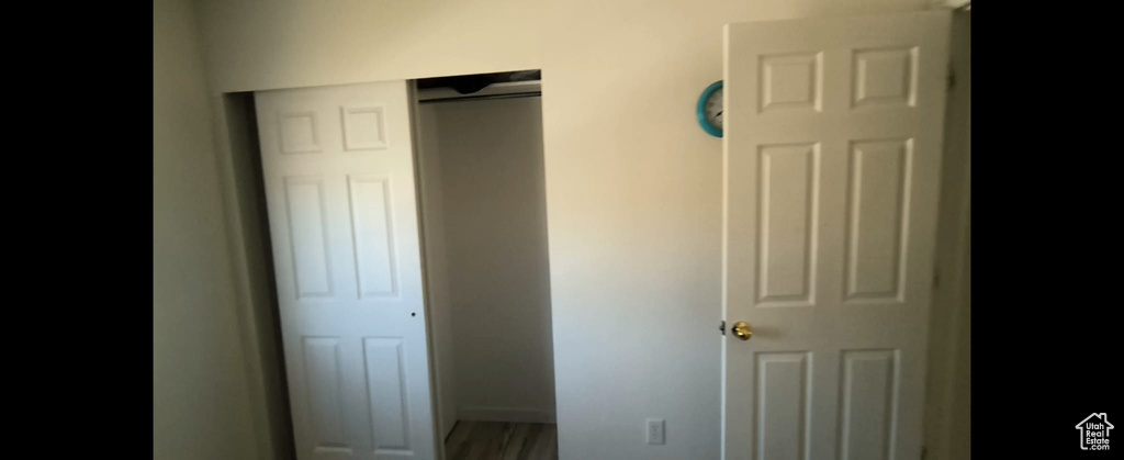 Unfurnished bedroom with a closet and baseboards