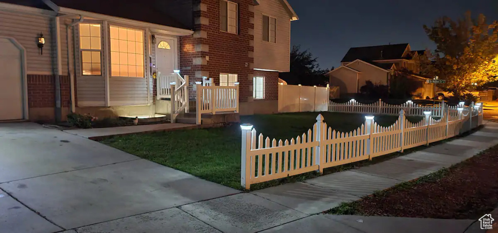 Exterior space with a fenced front yard