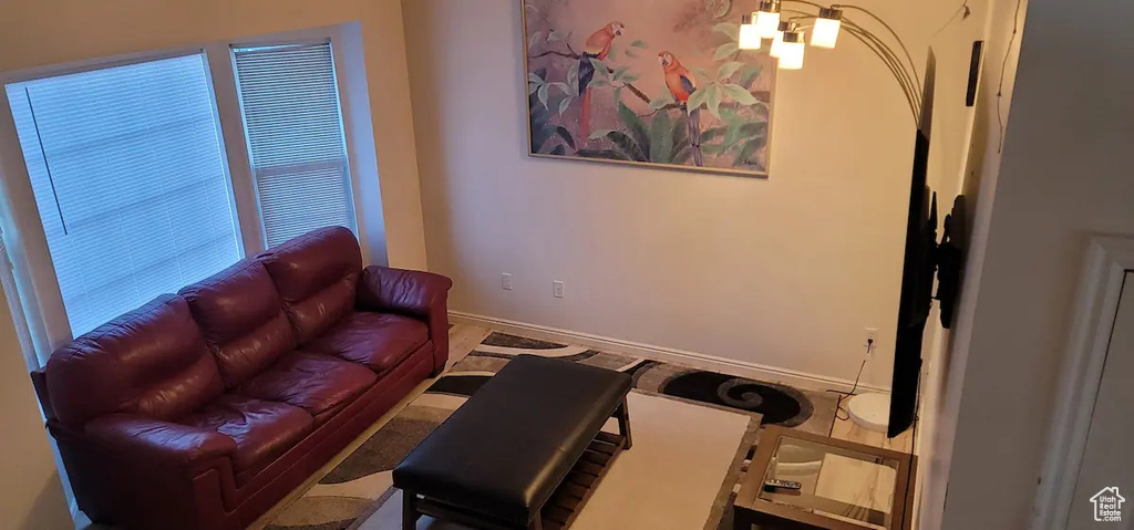 Living area with a chandelier and baseboards