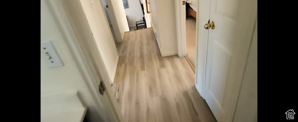 Corridor with light wood finished floors