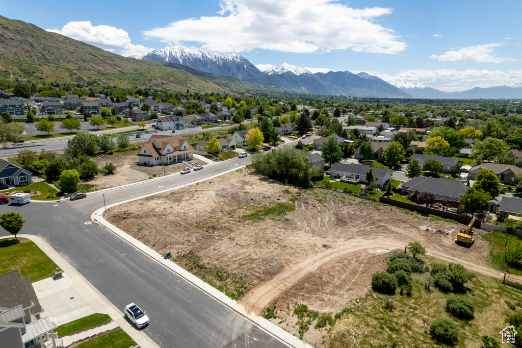 Aerial perspective of suburban area with a mountain backdrop