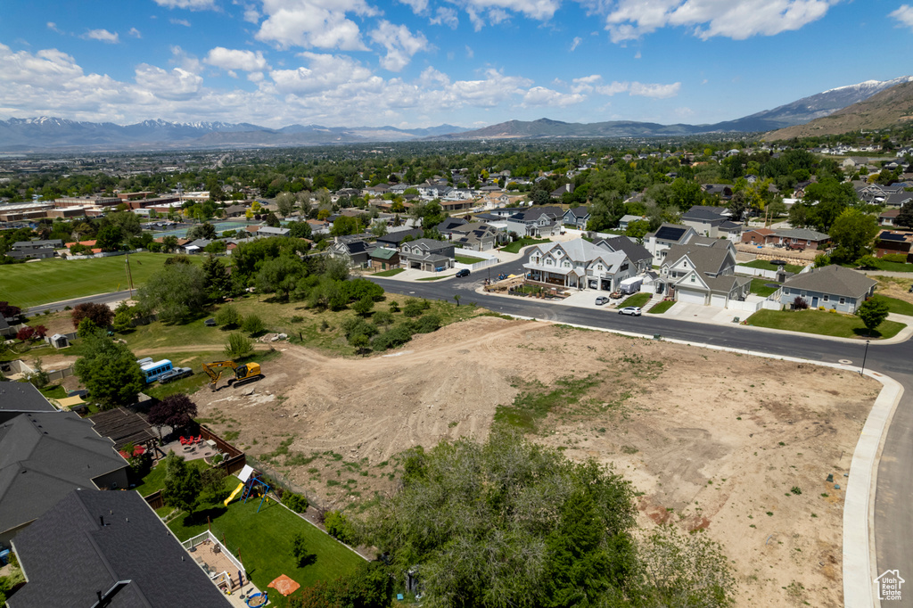 Aerial view of residential area with a mountainous background