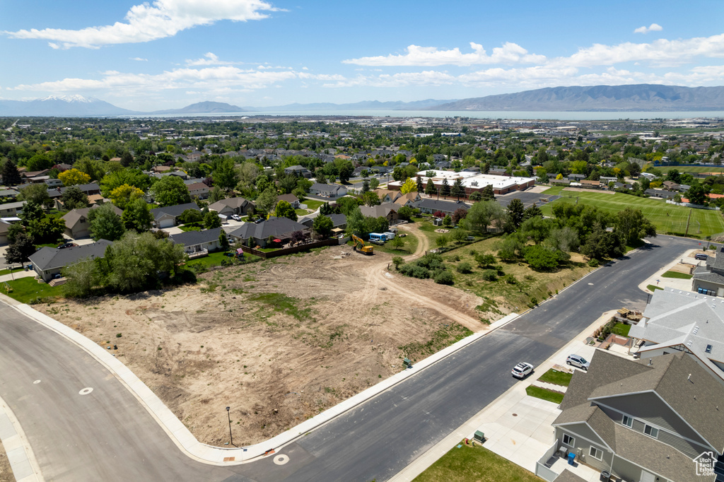 Aerial perspective of suburban area with a mountain backdrop