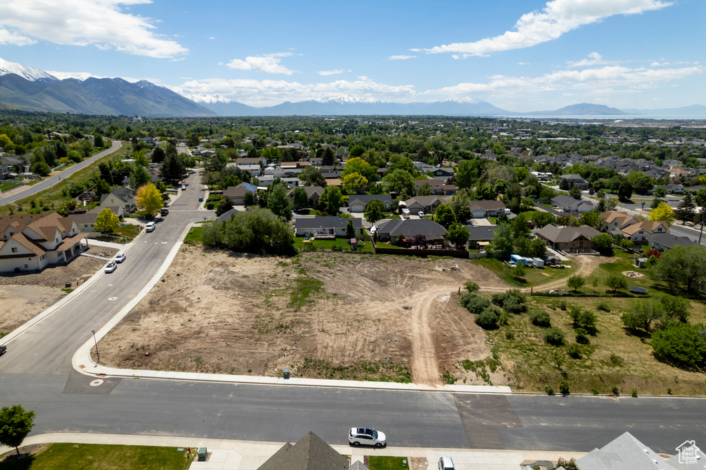 Aerial perspective of suburban area featuring a mountainous background