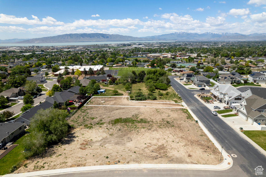 Aerial perspective of suburban area with a mountainous background