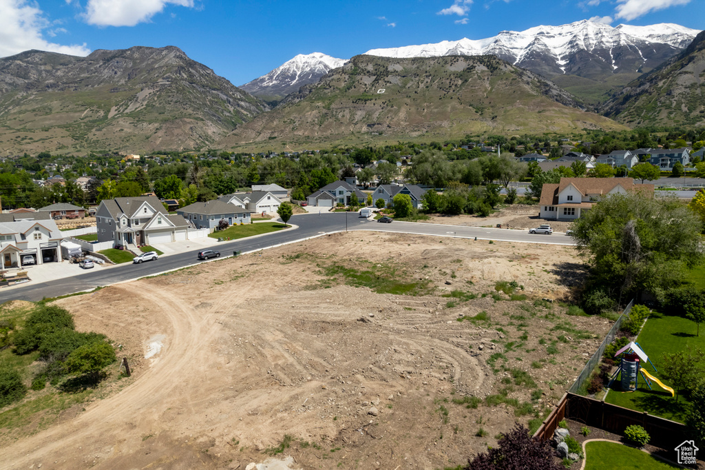 View of mountain backdrop featuring nearby suburban area