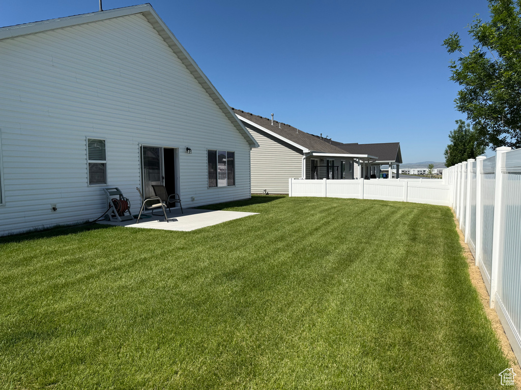 Rear view of house with a patio
