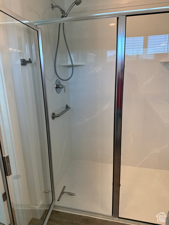 Full bathroom with a shower stall