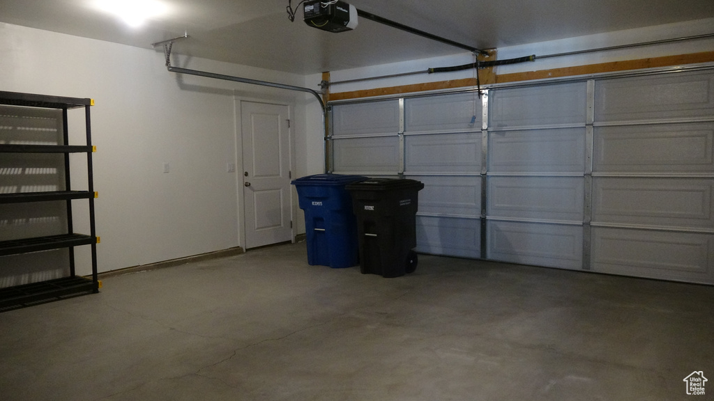 Garage featuring a garage door opener
