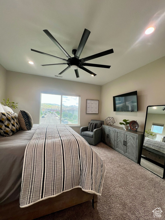 Bedroom featuring ceiling fan, recessed lighting, and carpet