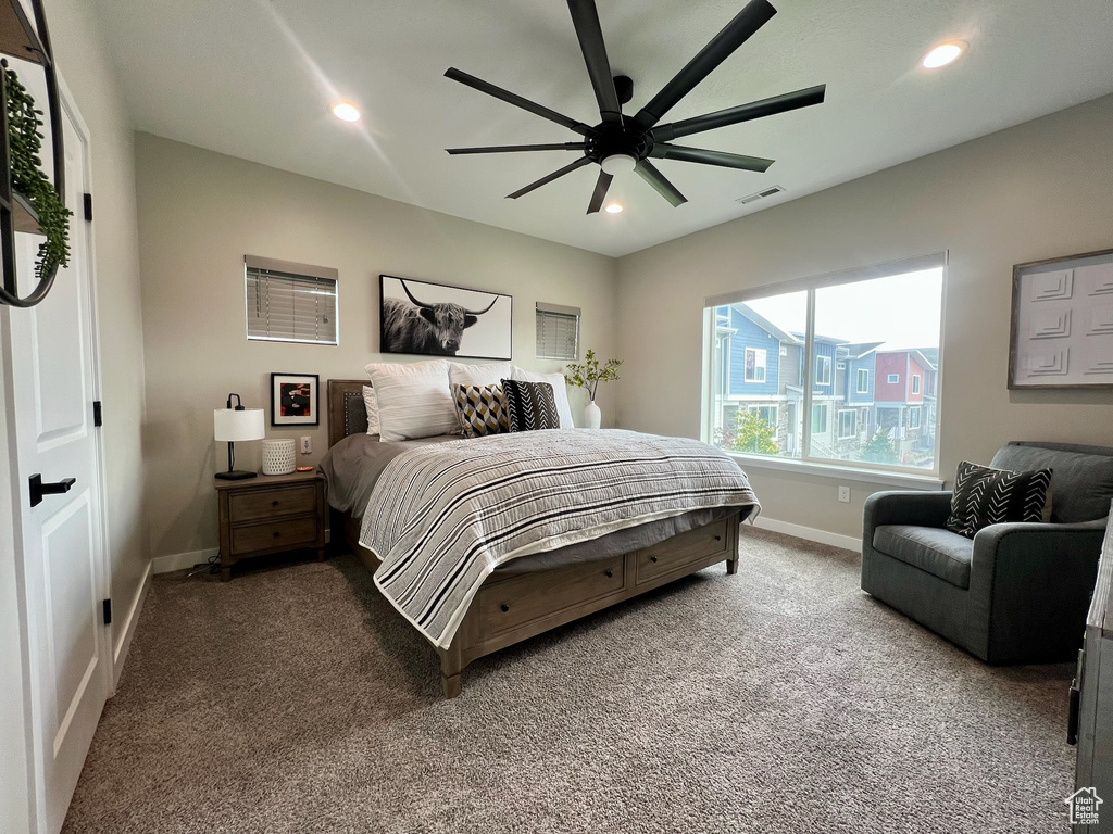 Carpeted bedroom with baseboards, recessed lighting, and a ceiling fan