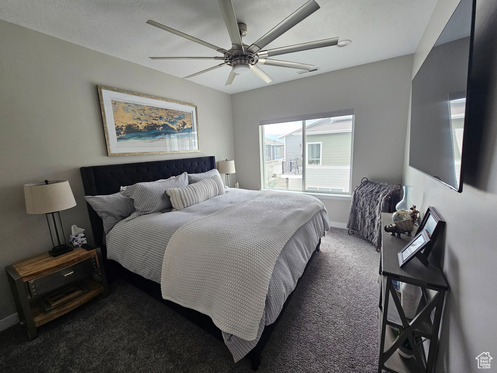 Bedroom with carpet and ceiling fan