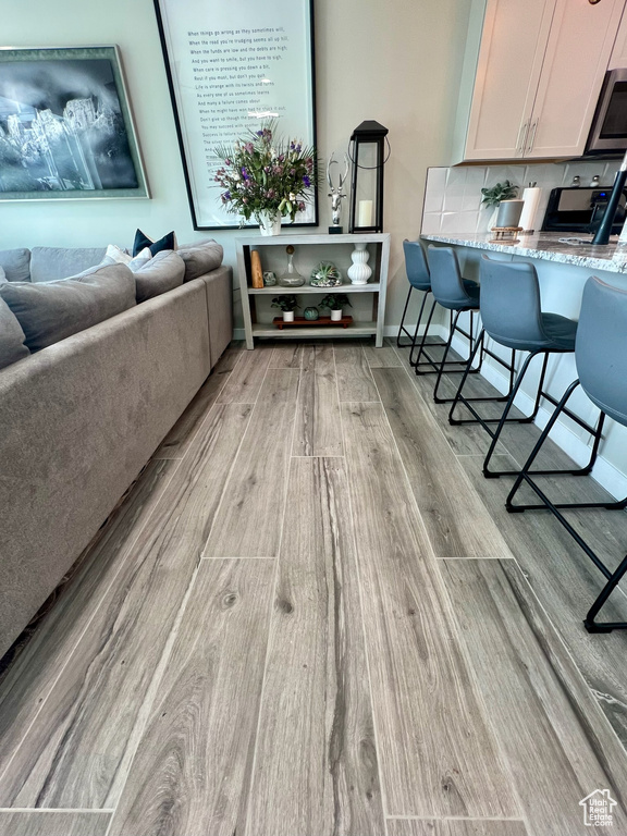 Living area with light wood-style floors