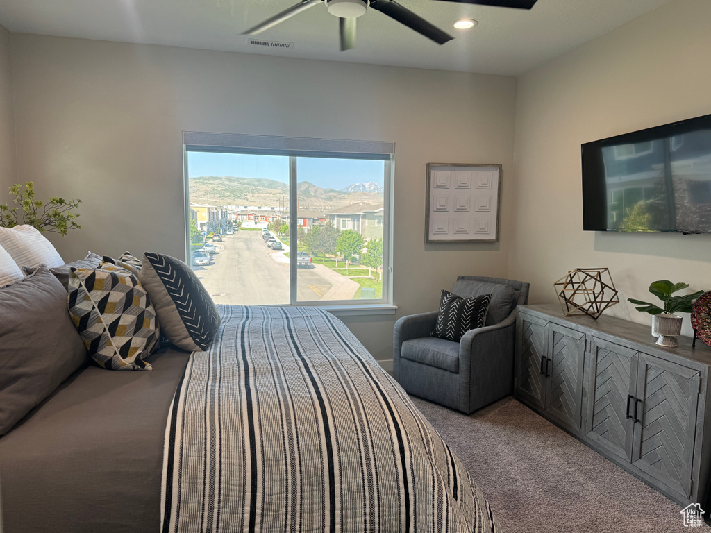 Bedroom featuring carpet floors, ceiling fan, and recessed lighting