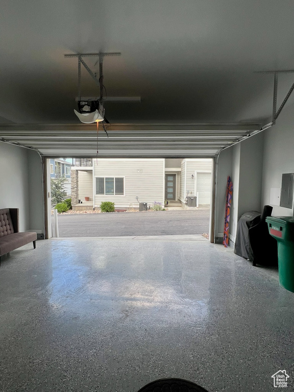 Garage with a garage door opener and electric panel