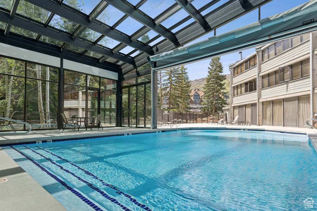 Community pool with a patio