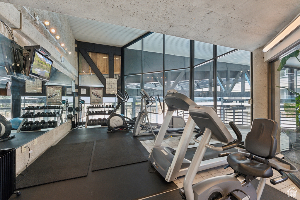 Exercise room featuring floor to ceiling windows