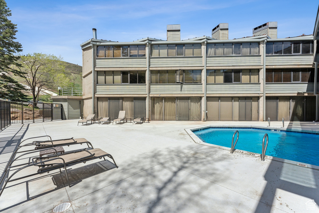 Community pool with a patio area