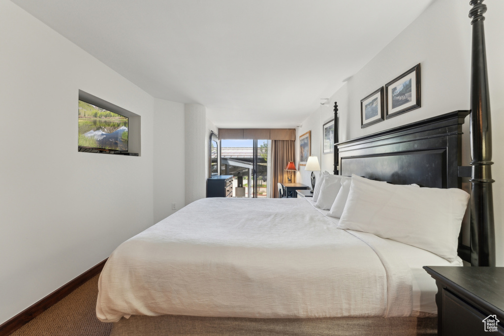 Carpeted bedroom with baseboards