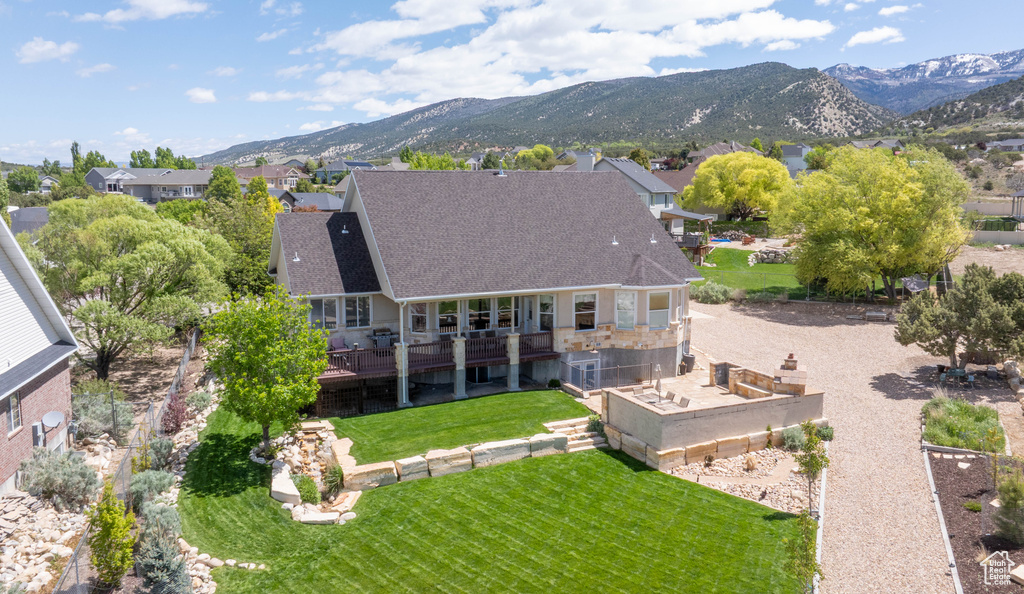 Aerial view of residential area featuring mountains