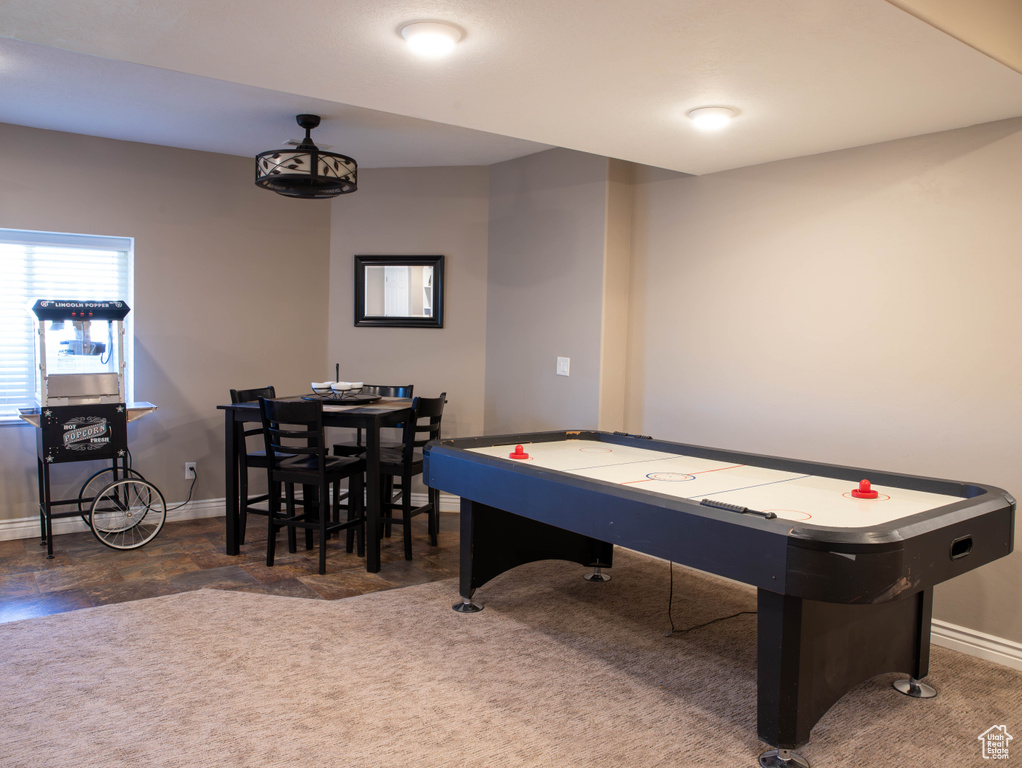 Playroom with baseboards and carpet flooring