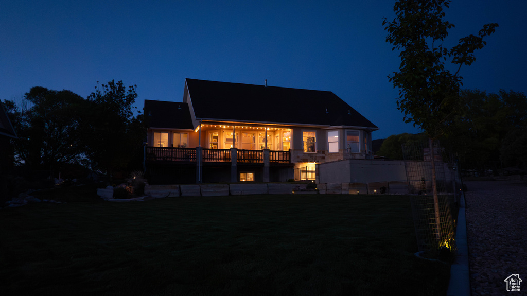 View of back of house at night