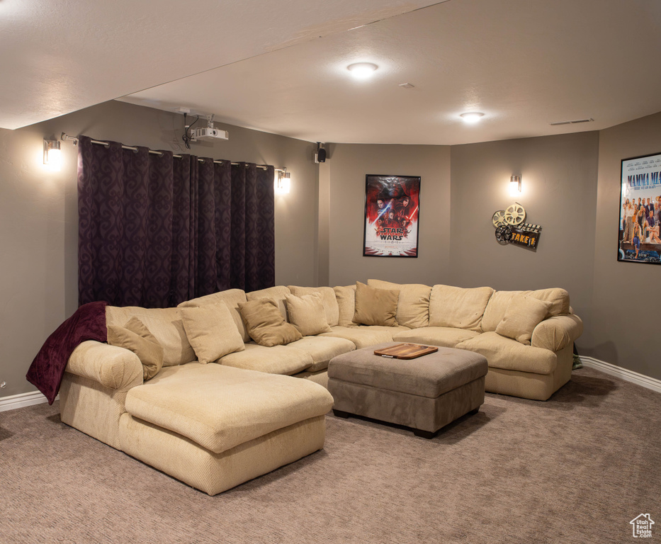 Living area with carpet floors and baseboards