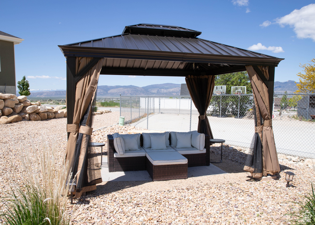 View of patio featuring a gazebo, a mountain view, and outdoor lounge area