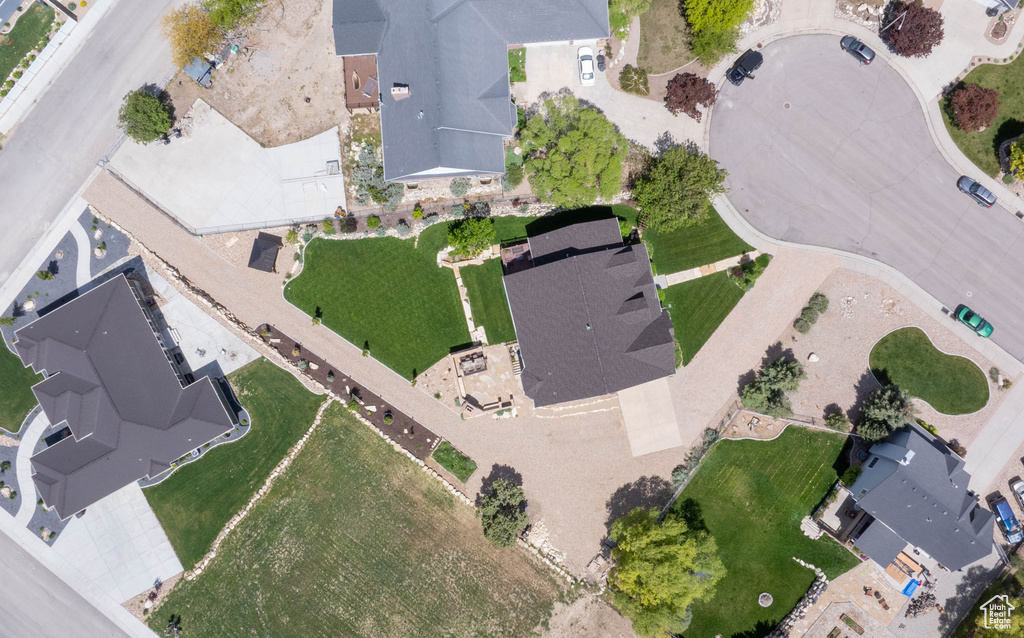 Aerial view of property and surrounding area featuring nearby suburban area