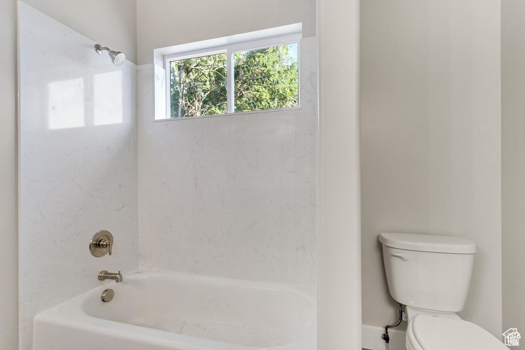 Bathroom with toilet and  shower combination