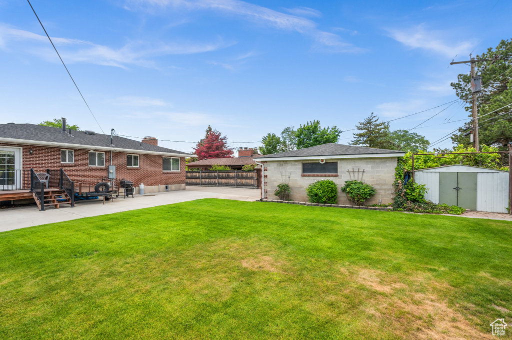 Back of house featuring a patio and brick siding