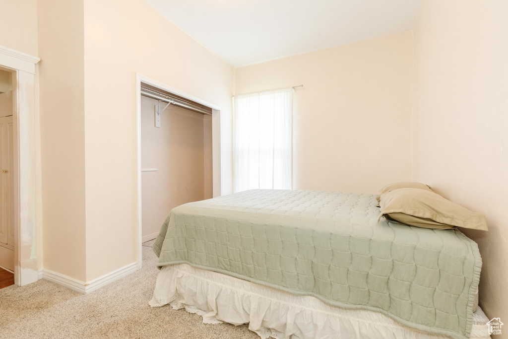 Carpeted bedroom with baseboards