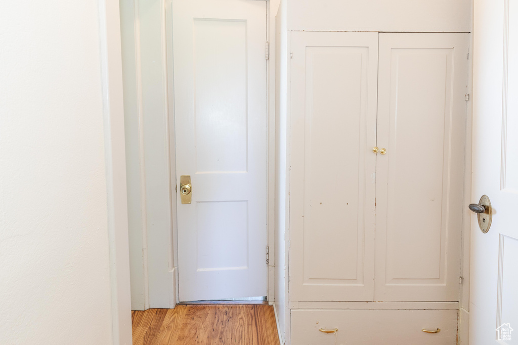 Hallway featuring light wood-type flooring