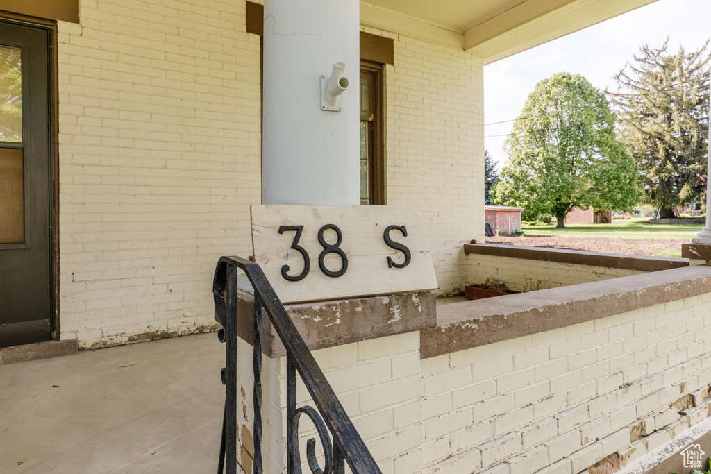 Entrance to property with brick siding